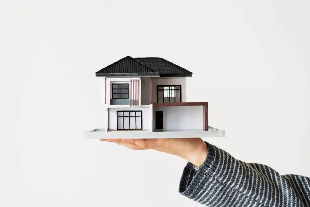 hand-presenting-model-house